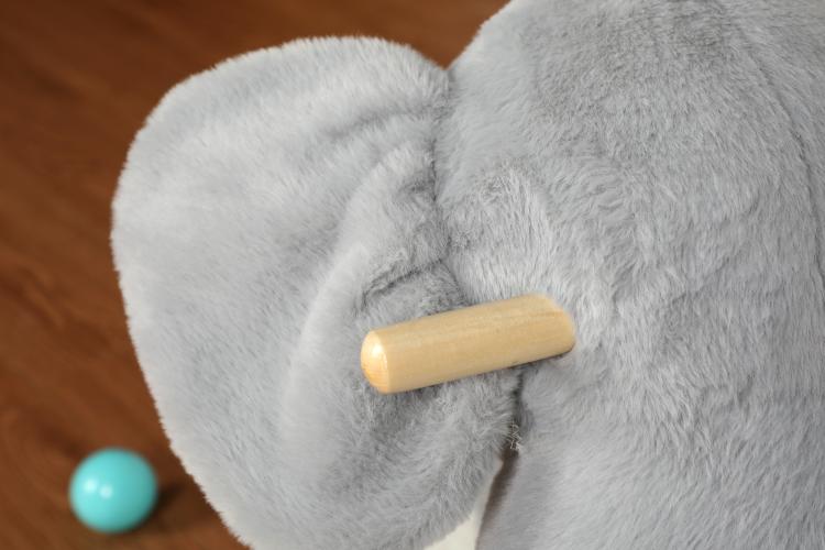 Grey plush elephant rocking toy wooden handle detail on the rocker