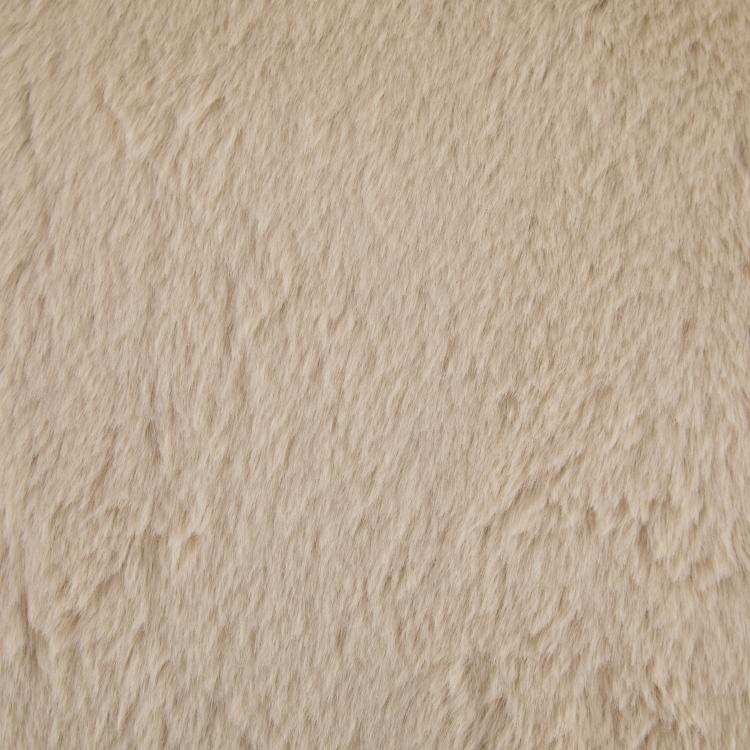 Tan faux fur upholstery fabric close-up with dense, fluffy texture