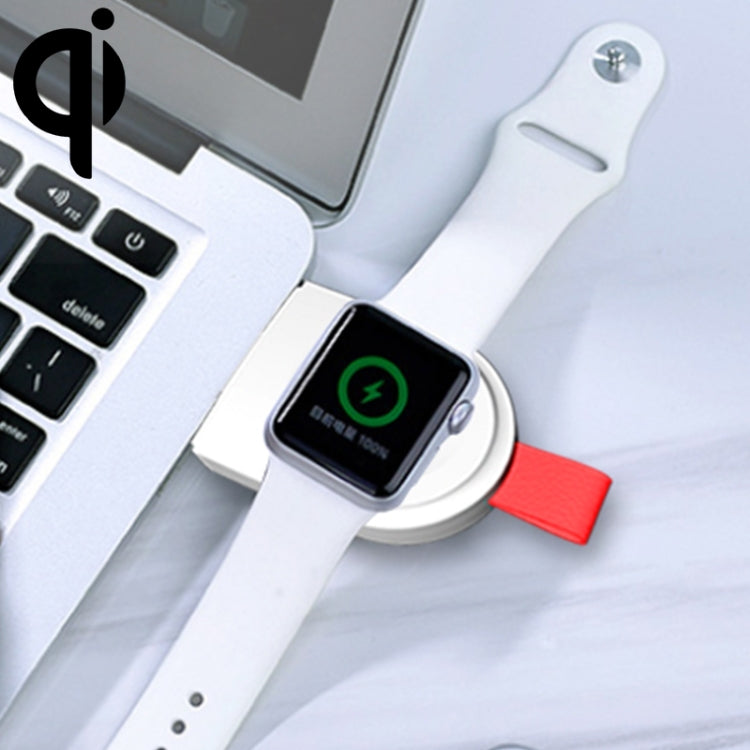 White magnetic wireless charging dock with red strap, holding Apple Watch on charging zone