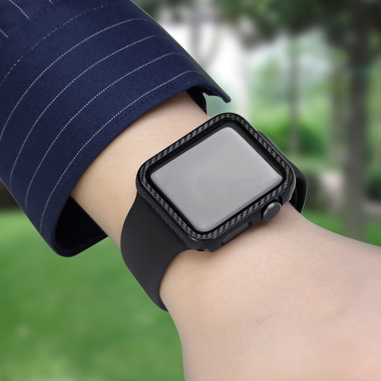 Apple Watch on wrist wearing a black carbon fiber frame protection case