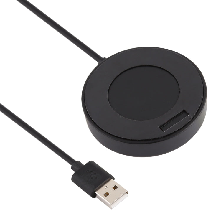 Round black charging puck with built-in dock and USB cable