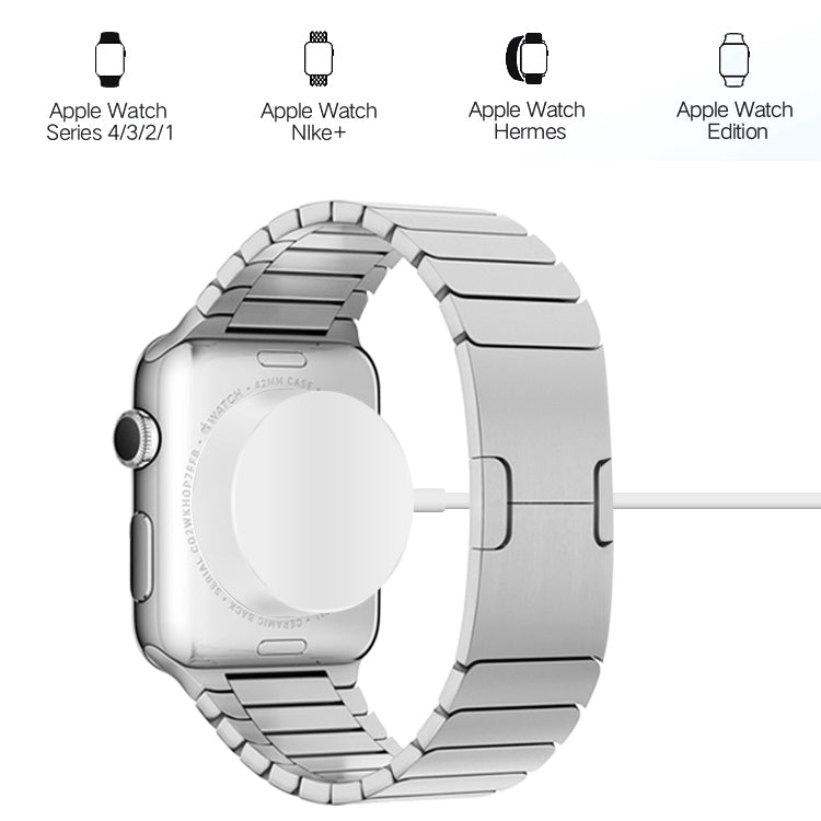 Magnetic wireless watch charging puck attached to a metal watch case