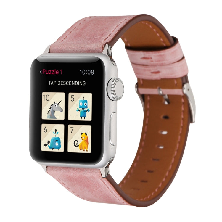Genuine leather Apple Watch band on wrist, pink strap with brown lining and silver buckle