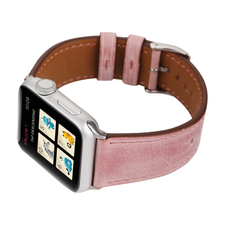 Genuine leather Apple Watch band on wrist, pink leather with brown lining and adjustable holes