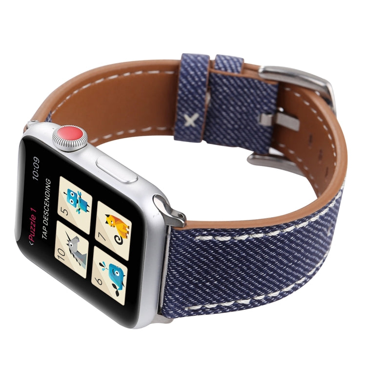 Dark blue woven watch band with tan leather lining and silver buckle on a smartwatch