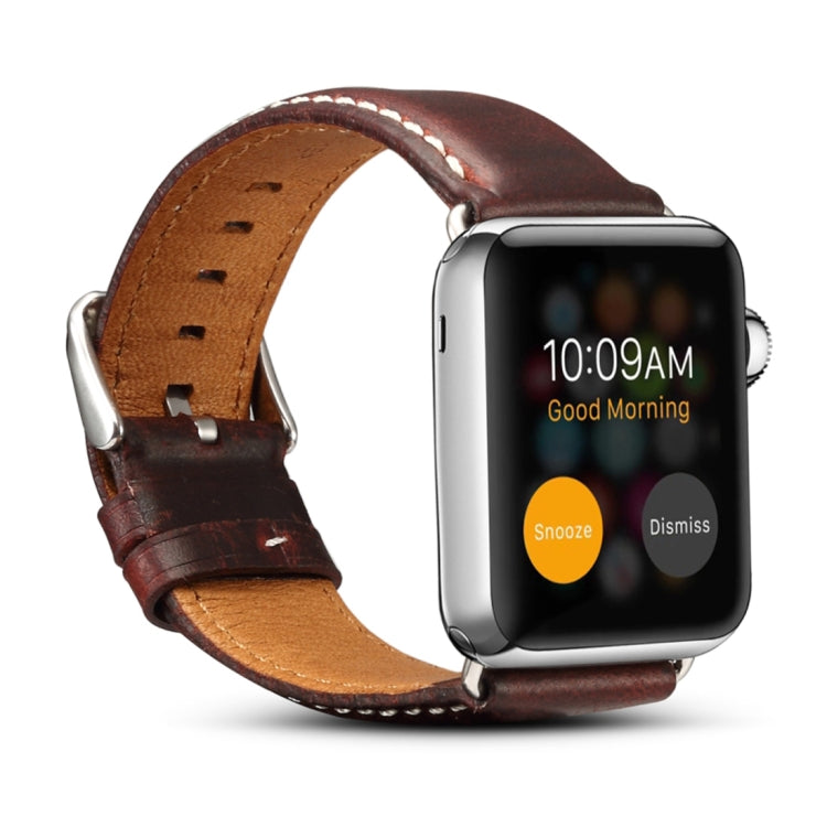 Dark brown leather watch band with metal buckle and stitched perforated strap