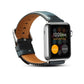 Dark blue leather watch band with metal buckle, tan lining, and perforated holes