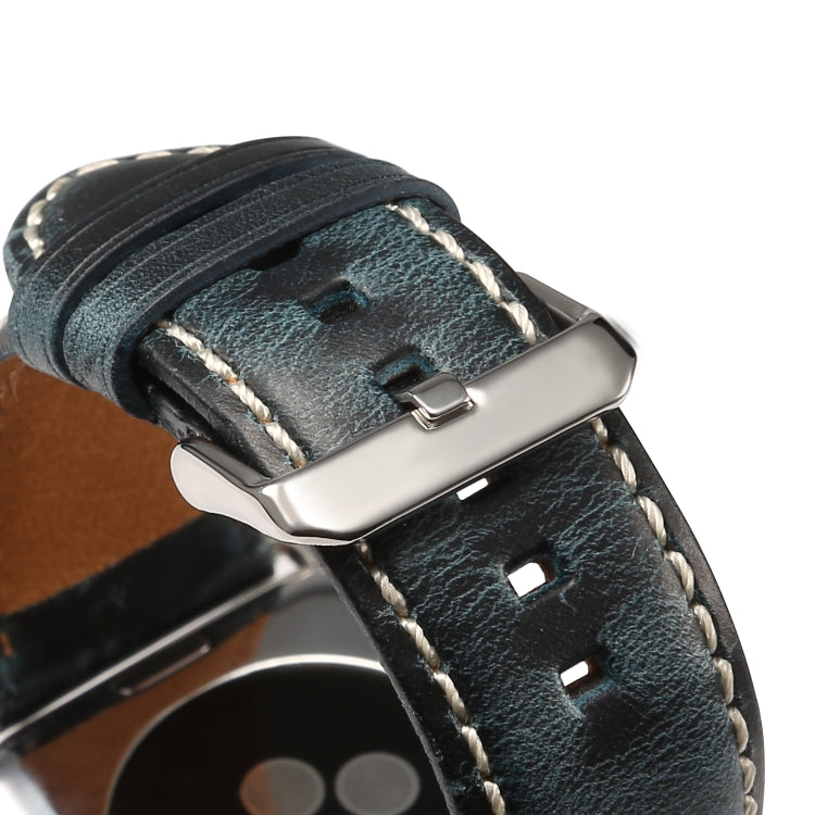 Dark blue leather watch band clasp close-up with white stitching and metal buckle