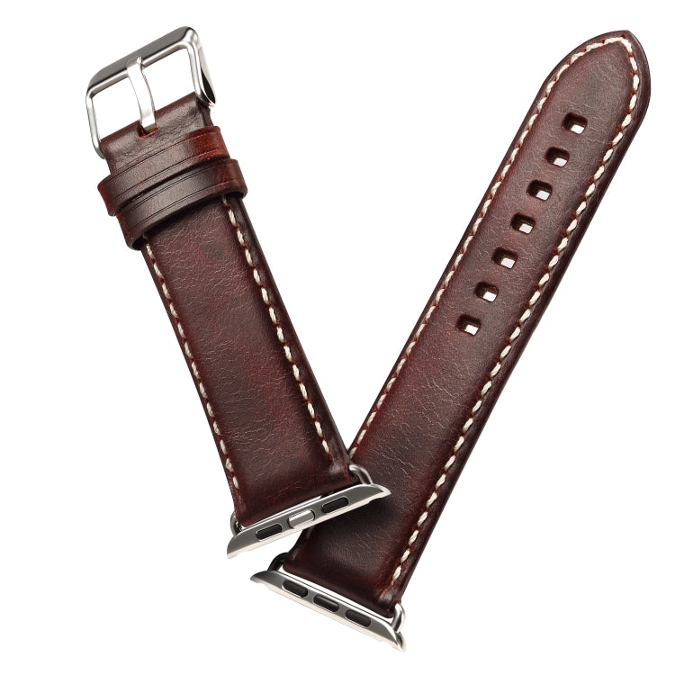 Brown leather watch band with metal clasp, stitched edges, and strap hole row