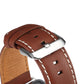 Denior leather watch band close-up, brown leather with silver buckle and stitched holes.