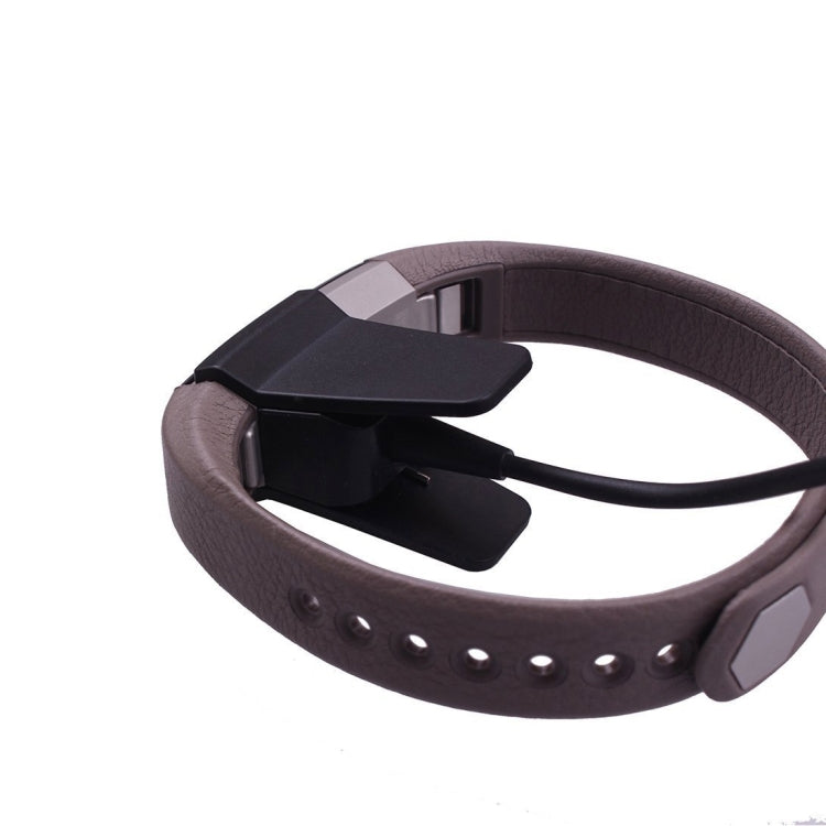 Black smartwatch charging cradle and cable for wrist band