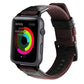 Apple Watch with brown woven nylon band, stainless buckle, and black leather back