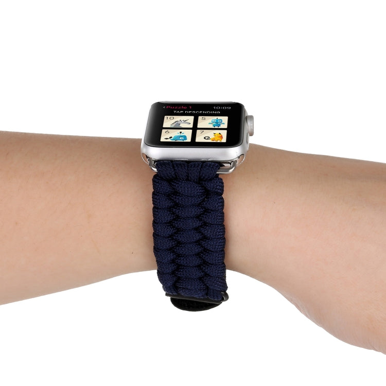 Dark blue braided nylon Apple Watch band on wrist with black leather ends