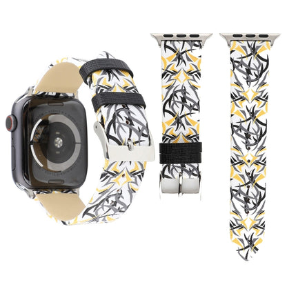 Leather watch band with yellow, white, and black thorn-like print; metal buckle visible