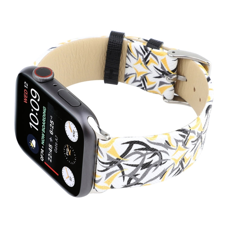 Leather watch band with black-and-yellow thorn print; silver buckle closure on wrist
