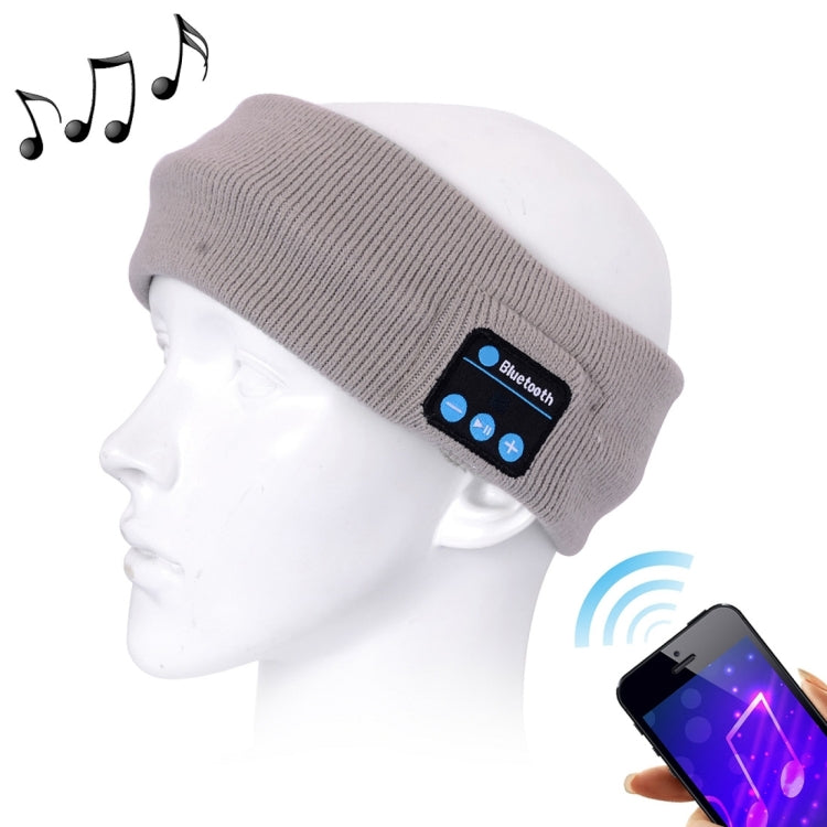 Grey knitted Bluetooth sport headband with blue button control panel and mic