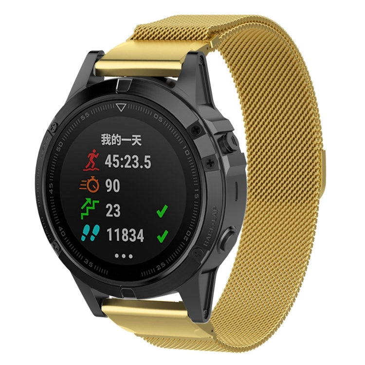 Gold milanese watch band with metal clasp, shown with a round smartwatch case