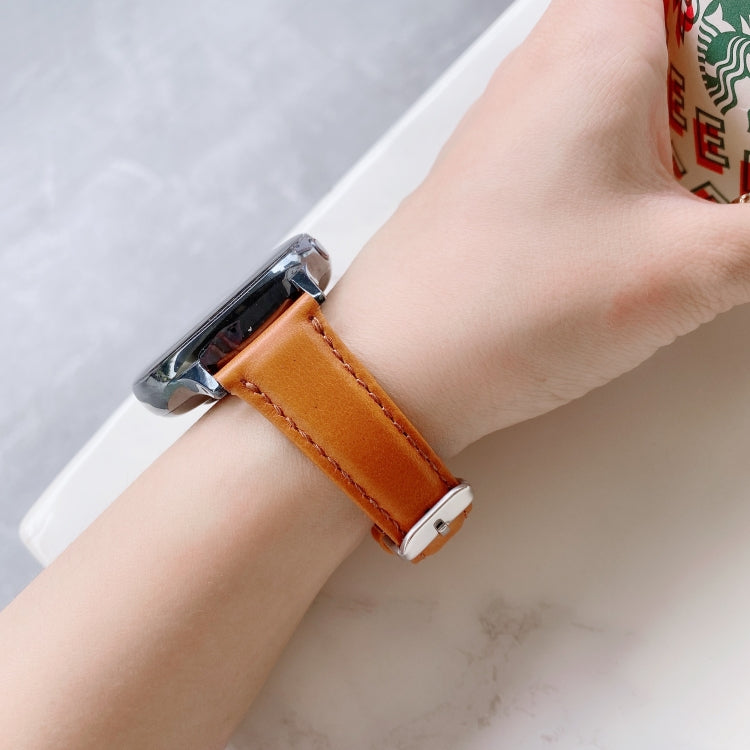 22mm leather watch band with silver buckle on wrist, double-sided strap in tan-brown