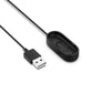 Black USB charging cable with USB-A connectors and oval charging dock cradle