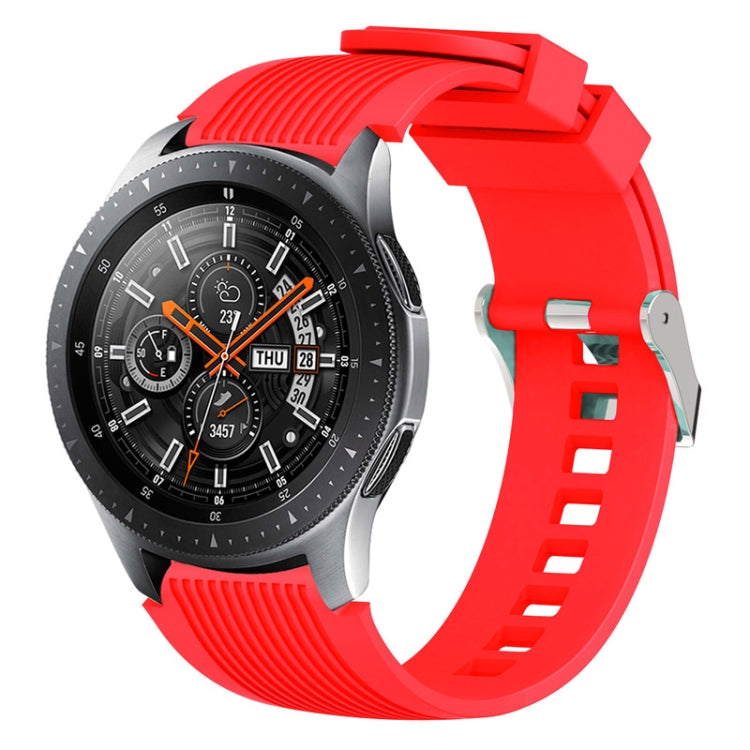 Red silicone watch band with vertical grain ridges and side buckle holes