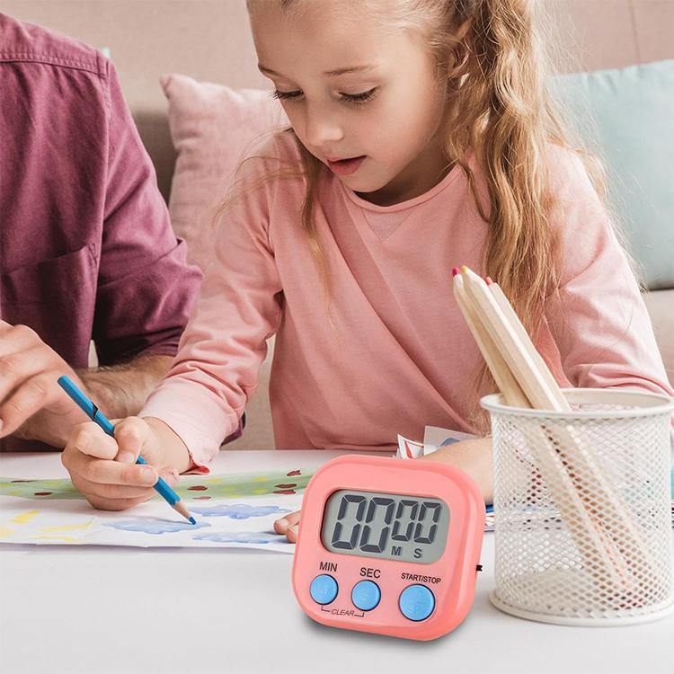 Pink digital LCD timer on tabletop with MIN, SEC, START/STOP, and CLEAR buttons