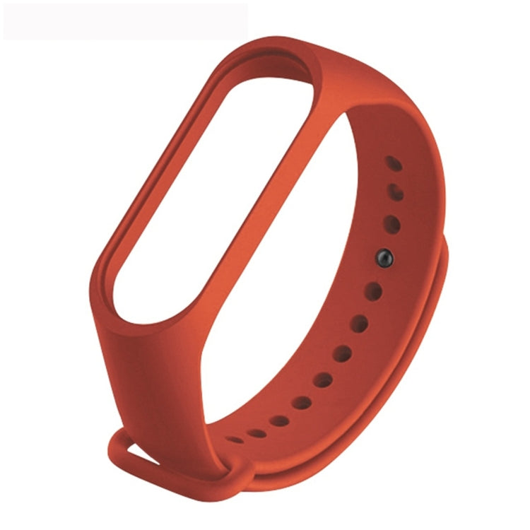 Soft TPU watch band with perforated strap in orange-red color
