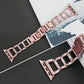 Rose gold diamond watch band with full row of faceted rectangular links