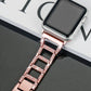Rose gold diamond watch band close-up with faceted rectangular link pattern