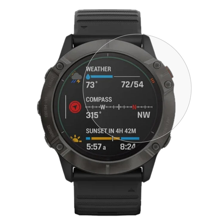 Garmin smartwatch screen protector film over round display on black silicone watch
