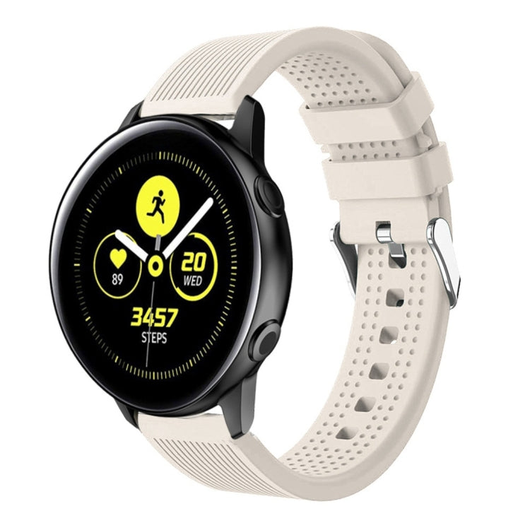 White silicone smartwatch band with perforated strap and metal buckle hardware