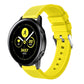 Yellow silicone smartwatch band with perforated strap and metal buckle clasp