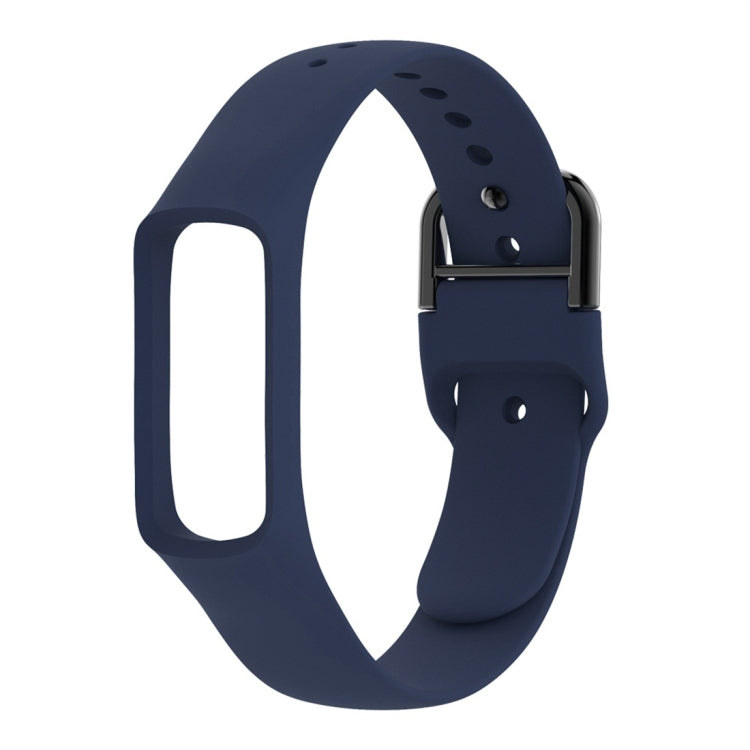 Dark blue silicone watch band with metal clasp and perforation holes for smartwatch, side view.