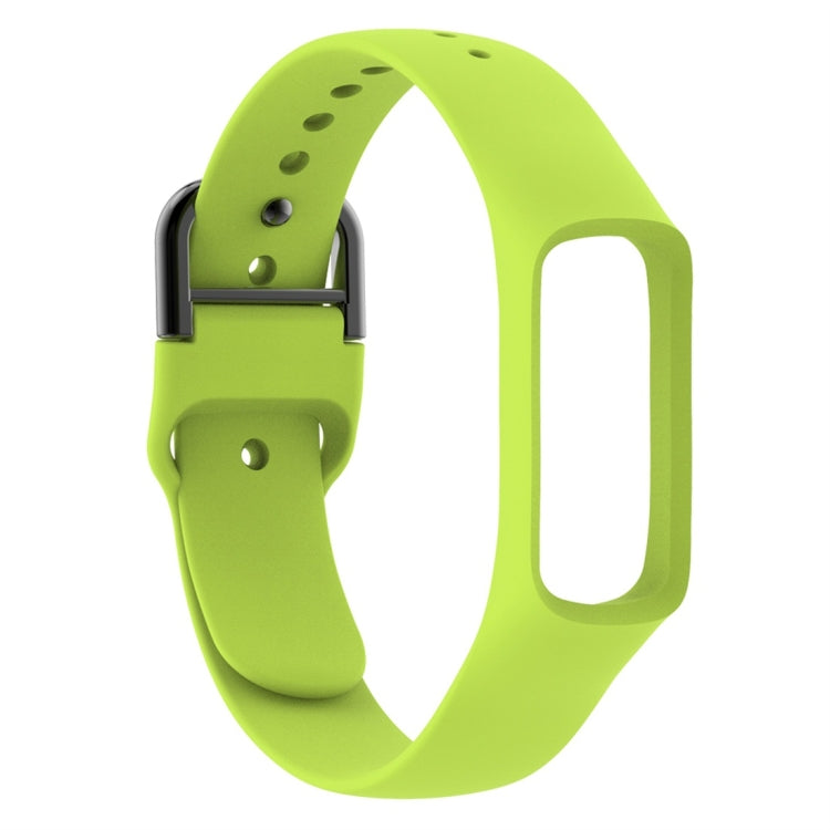 Green silicone smartwatch band with adjustable holes and metal clasp hardware, side view.