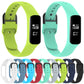 Set of silicone smartwatch bands in green and teal with buckle and holes.
