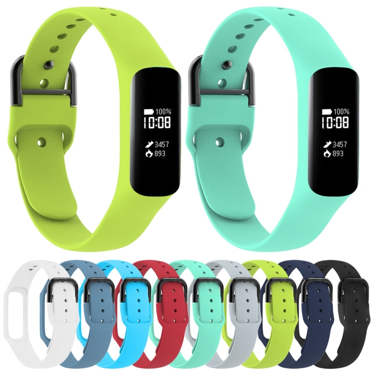Set of silicone smartwatch bands in green and teal with buckle and holes.