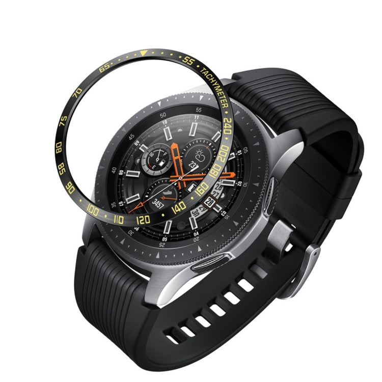 Black smartwatch with steel protective frame, yellow accent dial, and black textured silicone band