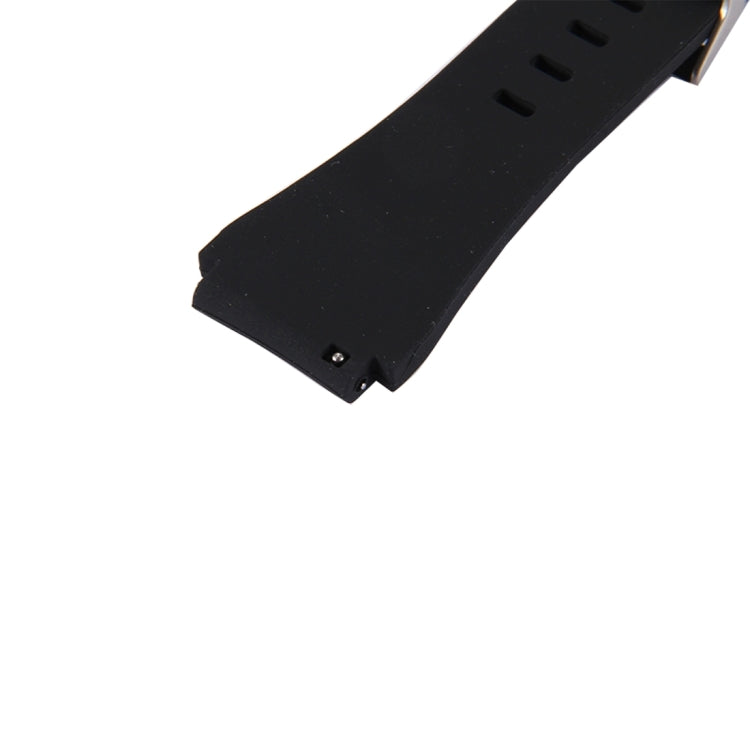 Black silicone watch band close-up, textured strap and metal clasp