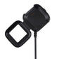 Black smartwatch charging cradle with attached cable and visible metal contacts