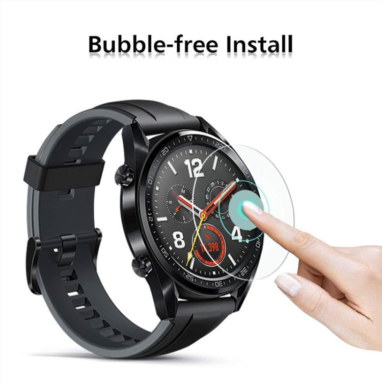 29mm tempered glass watch screen protector being applied by fingertip on black watch