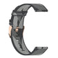 Grey nylon stripe-weave watch band with metal clasp and woven texture