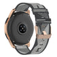 Grey nylon stripe-weave smartwatch band with metal buckle and adjustable strap holes