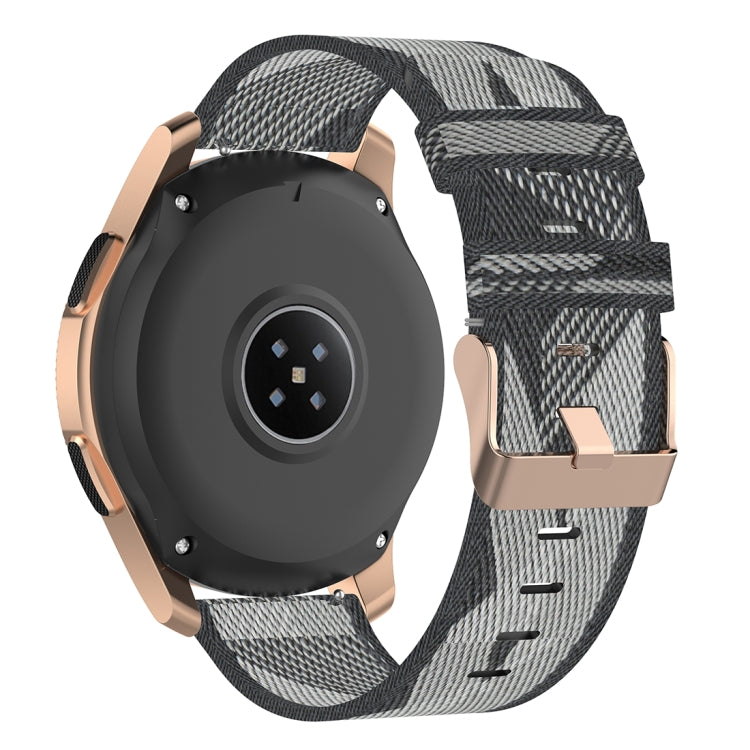Grey nylon stripe-weave smartwatch band with metal buckle and adjustable strap holes