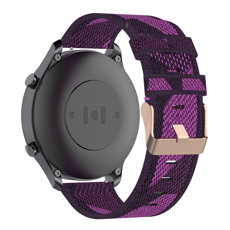 Purple woven nylon watch band with metal buckle on the watch case