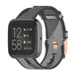 Woven nylon watch strap with grey and dark camo stripe pattern, metal pin buckle.