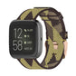 Woven nylon watch strap with yellow and dark camo stripe pattern, metal buckle.