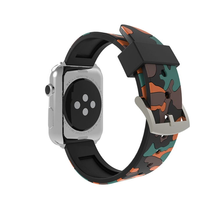 Silicone camouflage watch band with orange-red and teal pattern on silver smartwatch