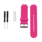 Pink silicone sport watch band with perforated strap and metal buckle.