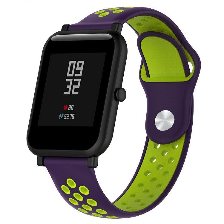 Silicone sport watch band with purple and lime green perforated straps, black watch case