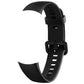 Black silicone watch band with textured strap end and adjustable buckle