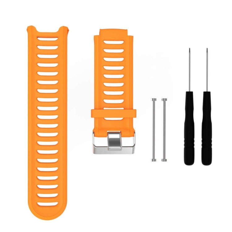 Orange silicone watch band with ridged strap and metal clasp, with extra pin tools